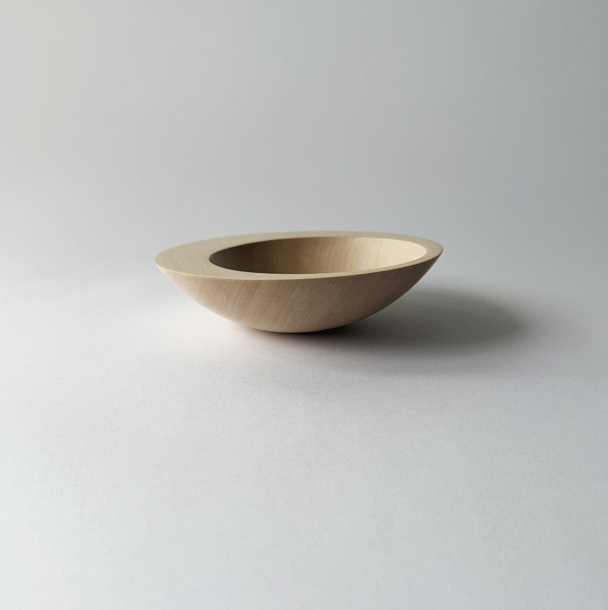 Tilted crescent bowl in sycamore