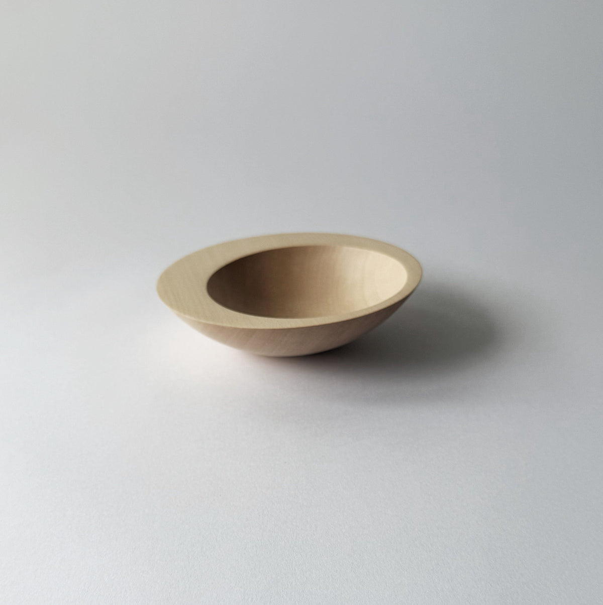 Tilted crescent bowl in sycamore