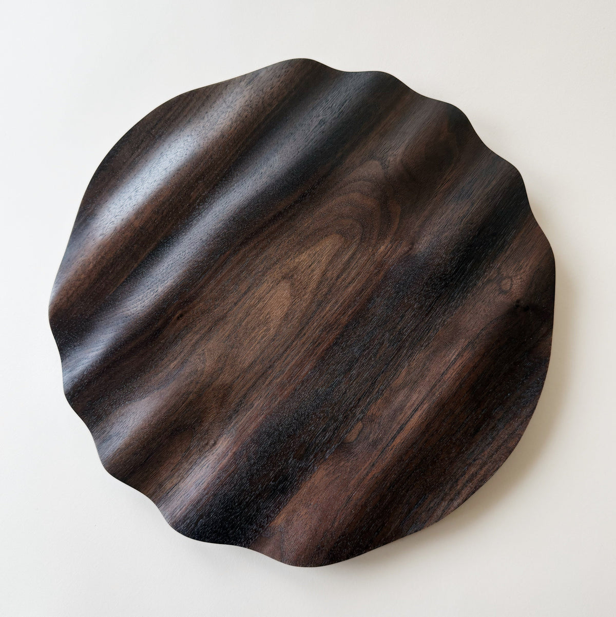 Wavy charger plate in vintage black walnut