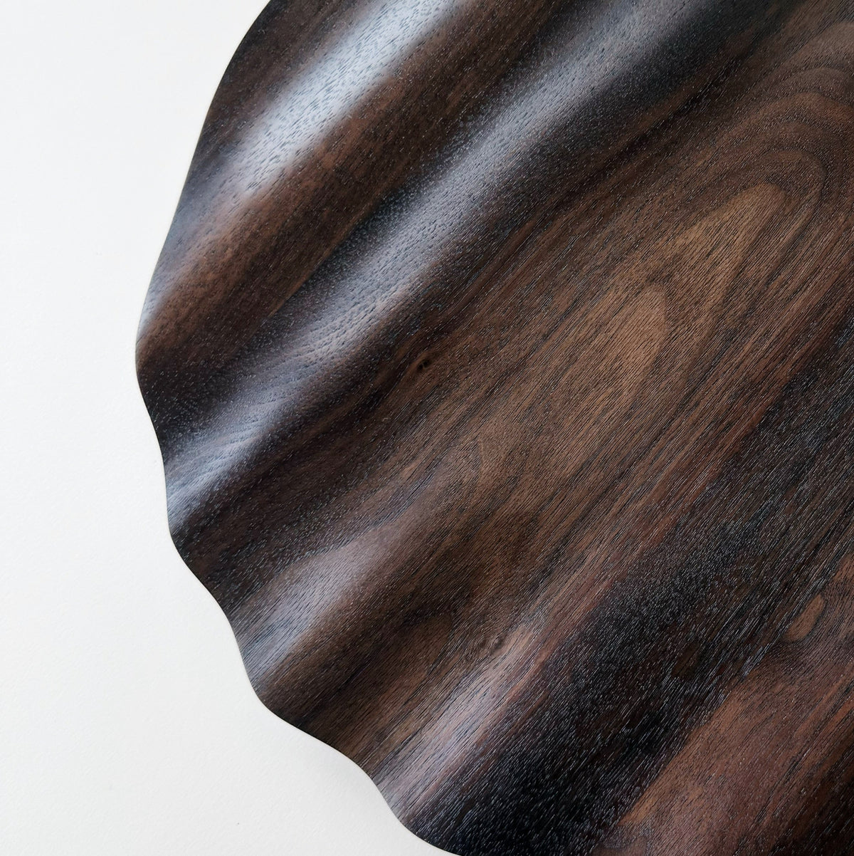 Wavy charger plate in vintage black walnut